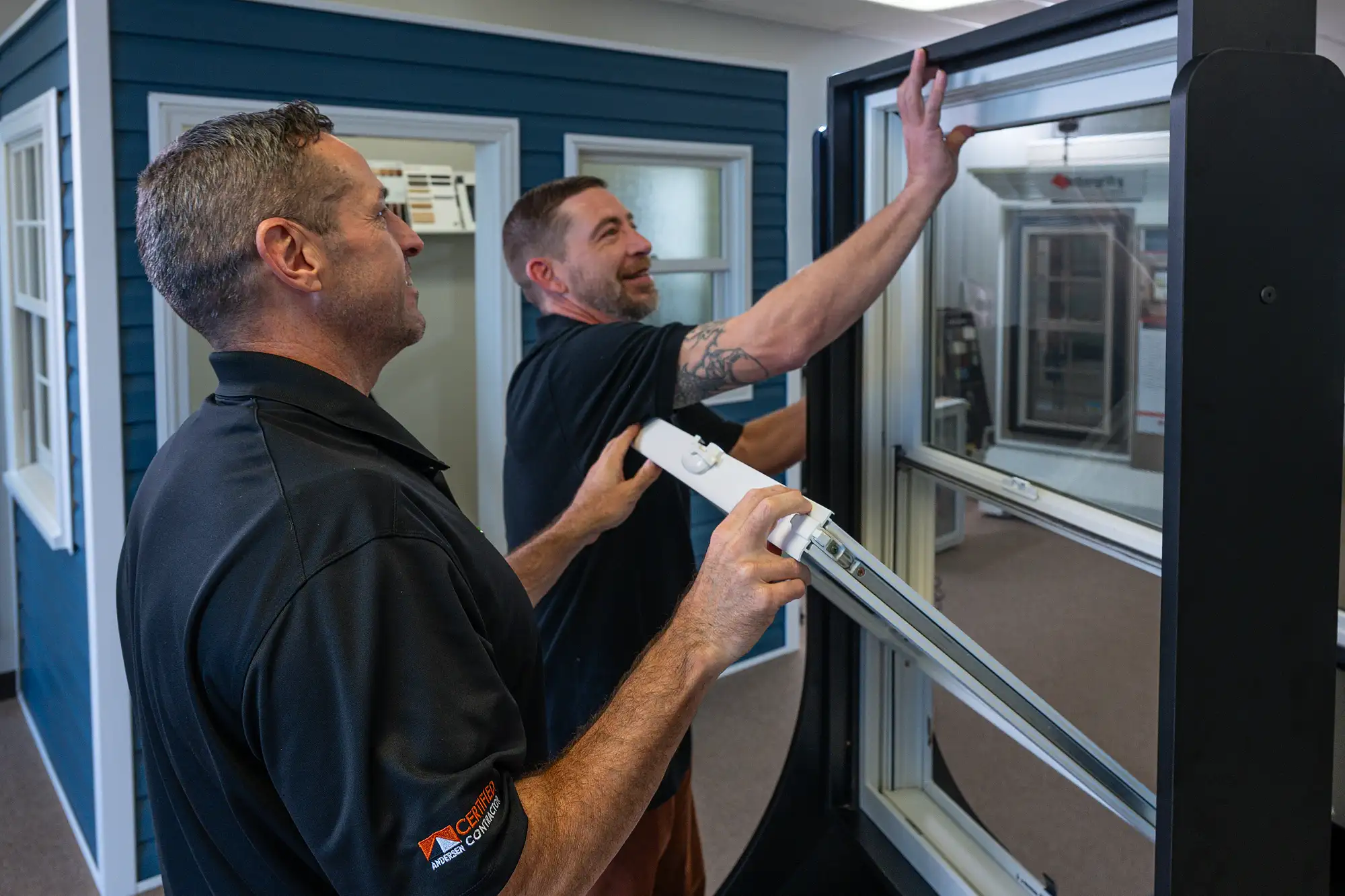 Sales representative helping customers select replacement windows
