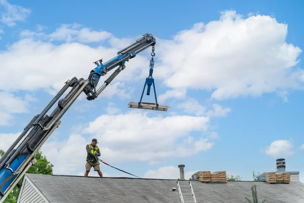 Roofing professionals preparing shingles for installation