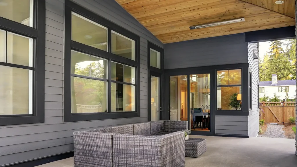 Black framed replacement windows on a modern home